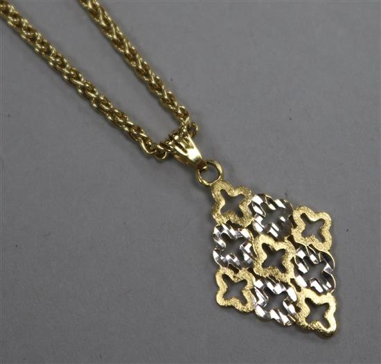 An 18ct yellow gold pierced lozenge-shaped pendant on fine chain, pendant 22mm.